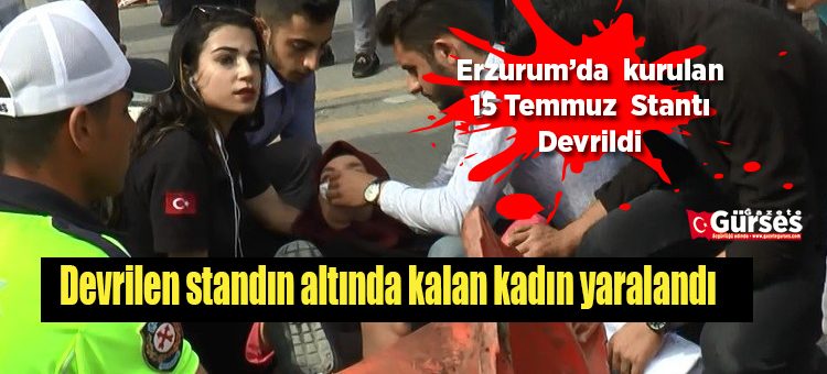 Devrilen standin altinda kalan kadin yaralandi